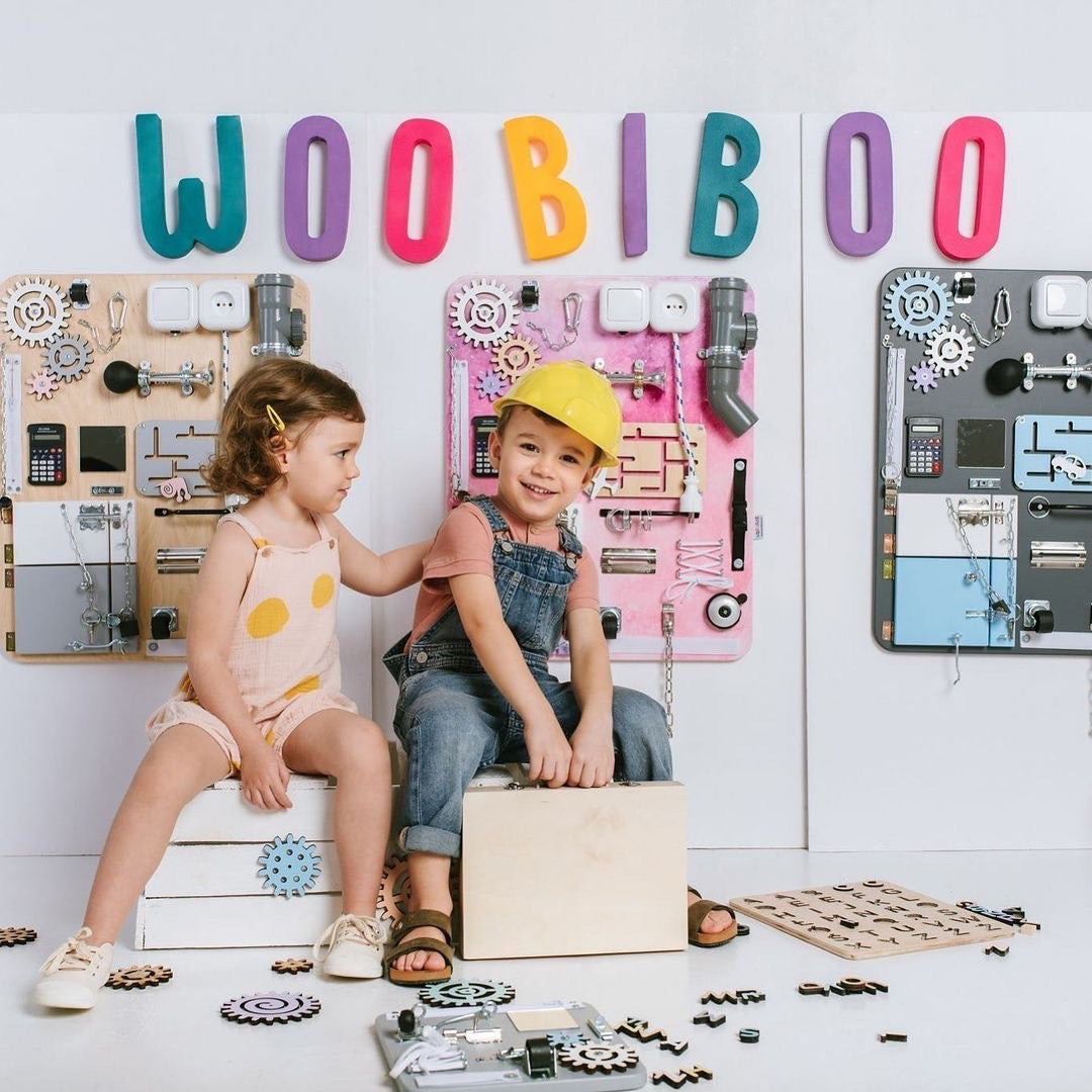 Woobiboo Wooden Busy Board (Natural/Pink)